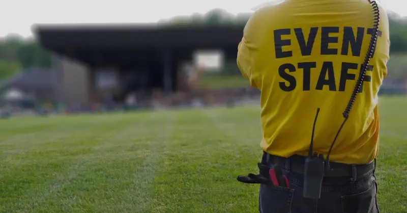 A person wearing a yellow 